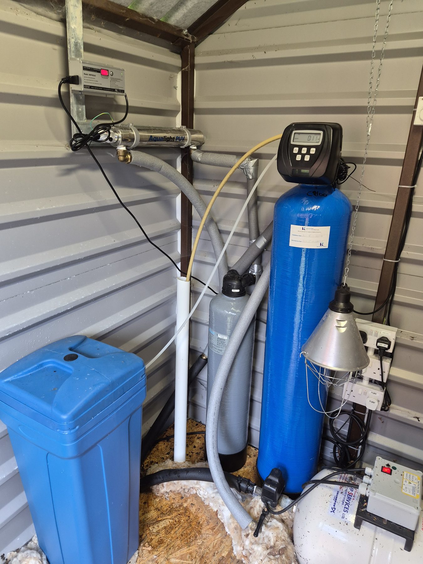 High-capacity water softener cylinder with a control head in a plant room